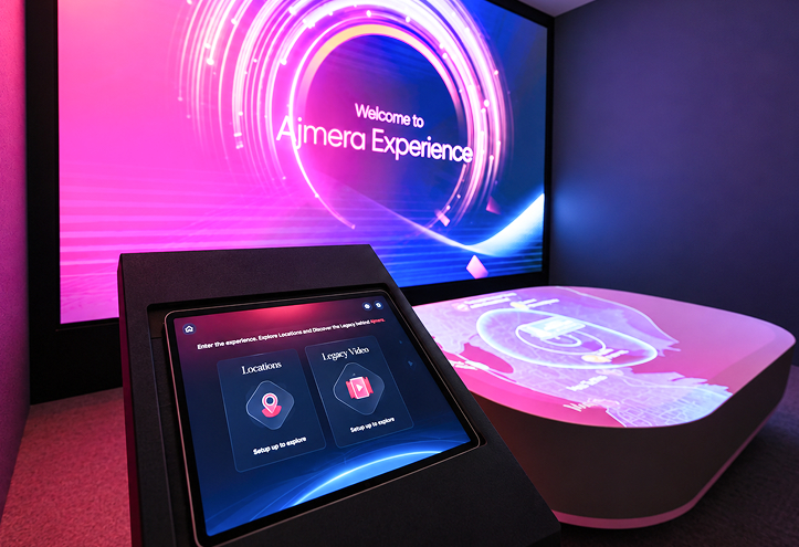 iPad-controlled projection mapping with interactive location table and large-format Ajmera experience display